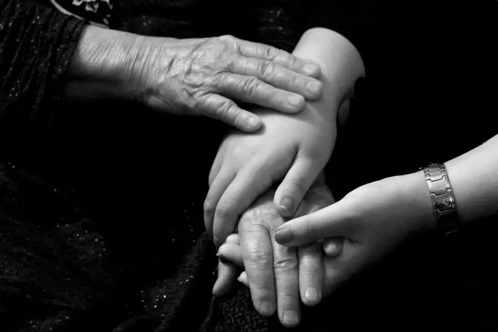 A senior and their grandchild bonding over a board game, showing the joy of reconnecting across generations.